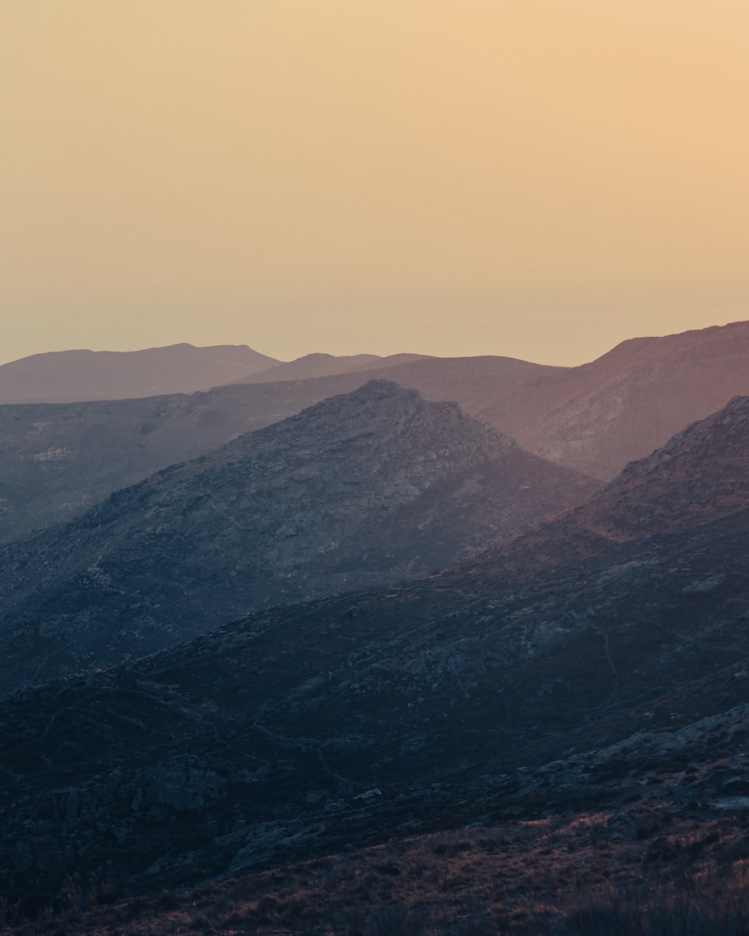 Layered Serifos hills at golden hour